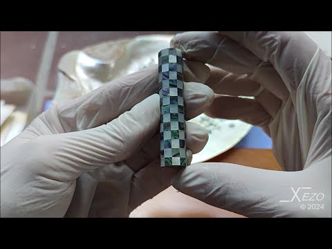 The process of creating 240 hand-cut checkers for the Maestro Jubilee checkered pen barrel out of white mother-of-pearl and Paua Abalone shells