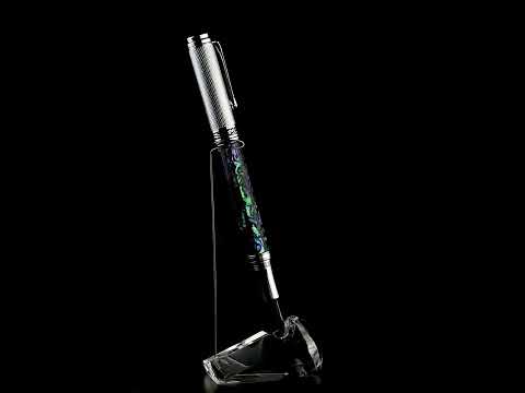Xezo - A Maestro Paua Abalone Chrome FM Fountain pen standing on a turning pen stand