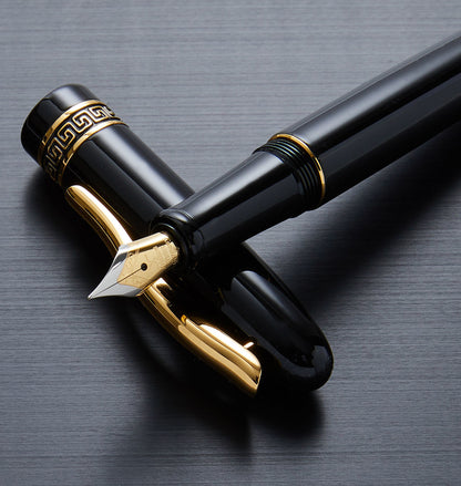 Xezo - Phantom Classic Black F fountain pen resting on its cap