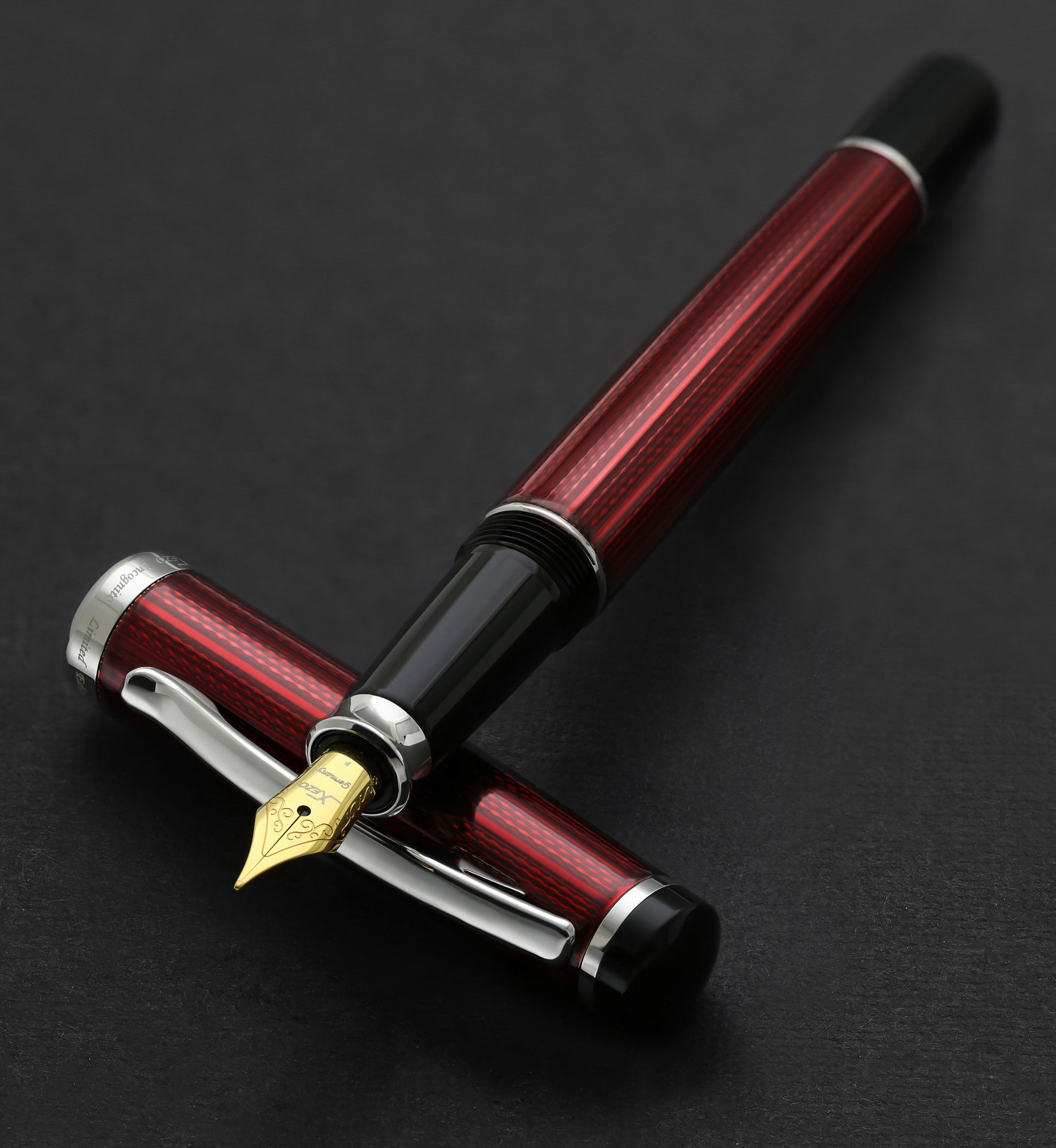 Xezo - Incognito Burgundy F-1 fountain pen resting on its cap