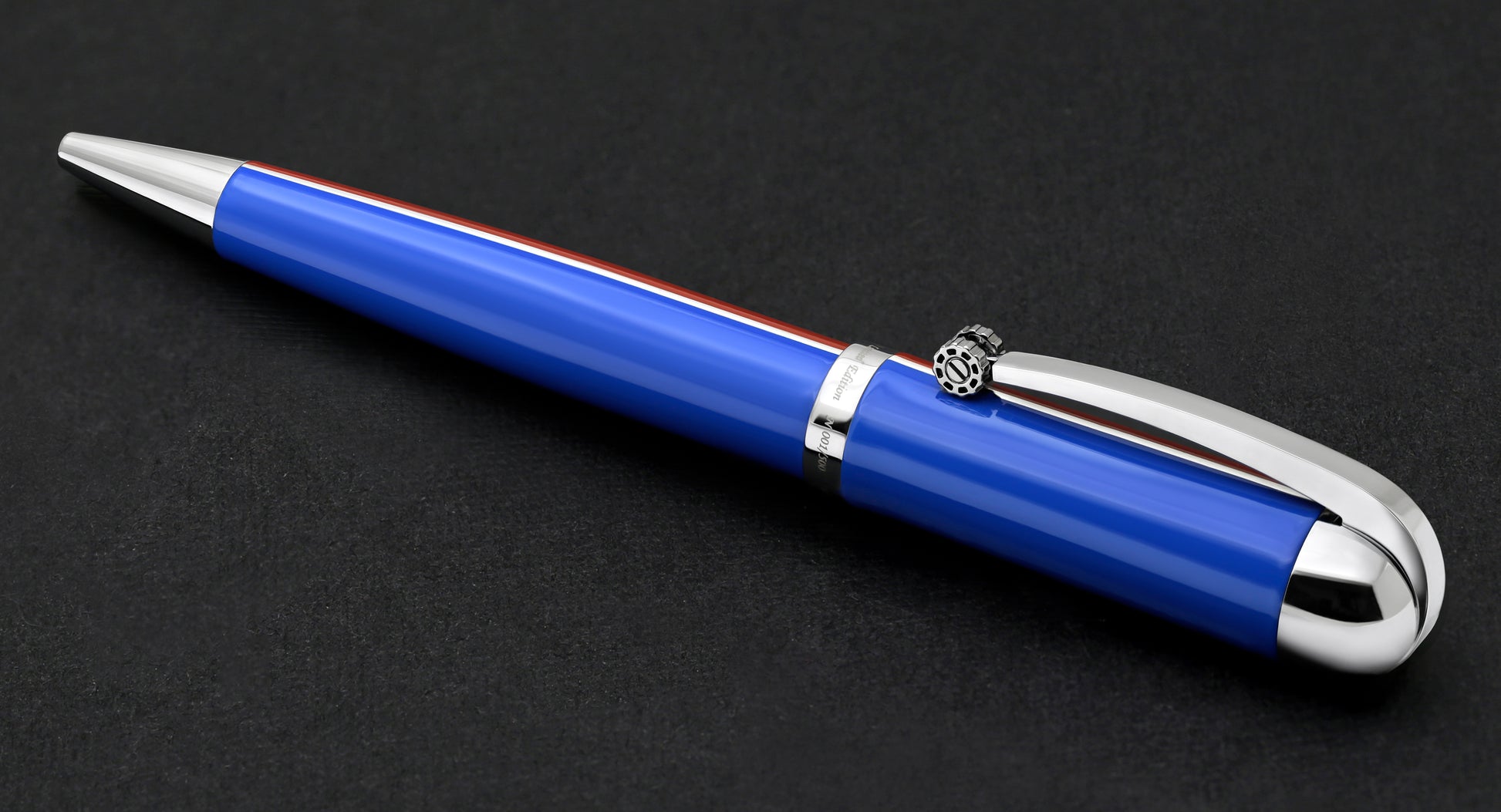 Xezo - Angled view of the side of the Visionary Red/Blue B ballpoint pen in neutral-tip position