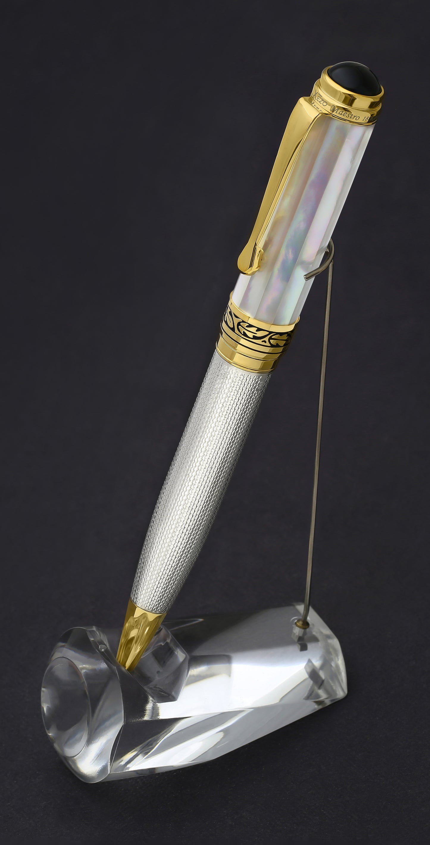 Xezo - Maestro White MOP B ballpoint pen standing on a pen holder
