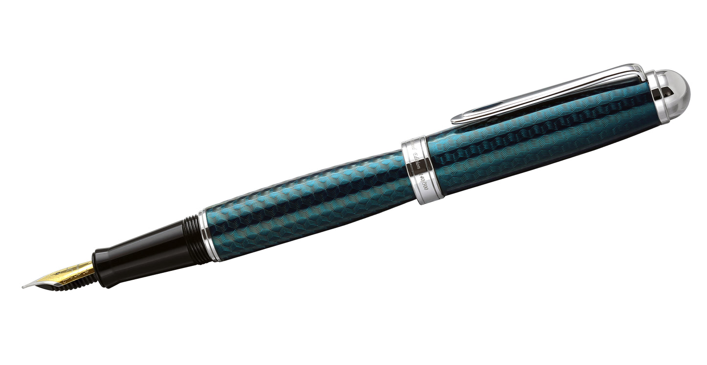 Xezo - Side angled view of the Freelancer Blue F fountain pen, with its cap posted on the end of the barrel