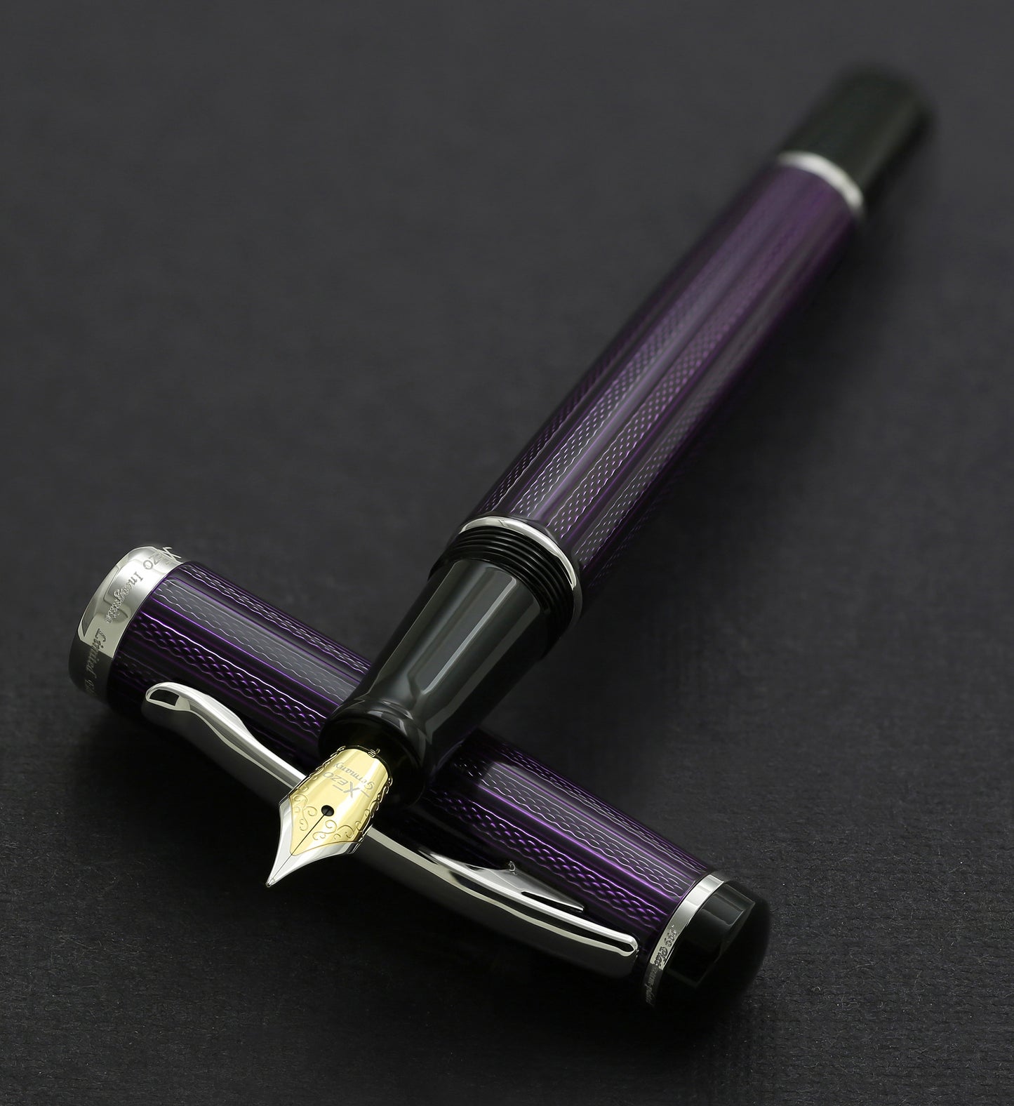 Xezo - Incognito Purple F fountain pen resting on its cap