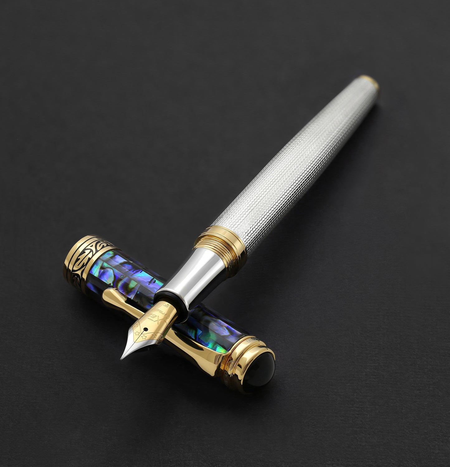 Xezo - The Maestro 925 Sea Shell F fountain pen resting on its cap