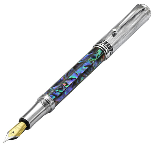 Xezo - Angled front view of the Maestro Paua Abalone Chrome F fountain pen (facing left), with the cap posted on the end of the barrel