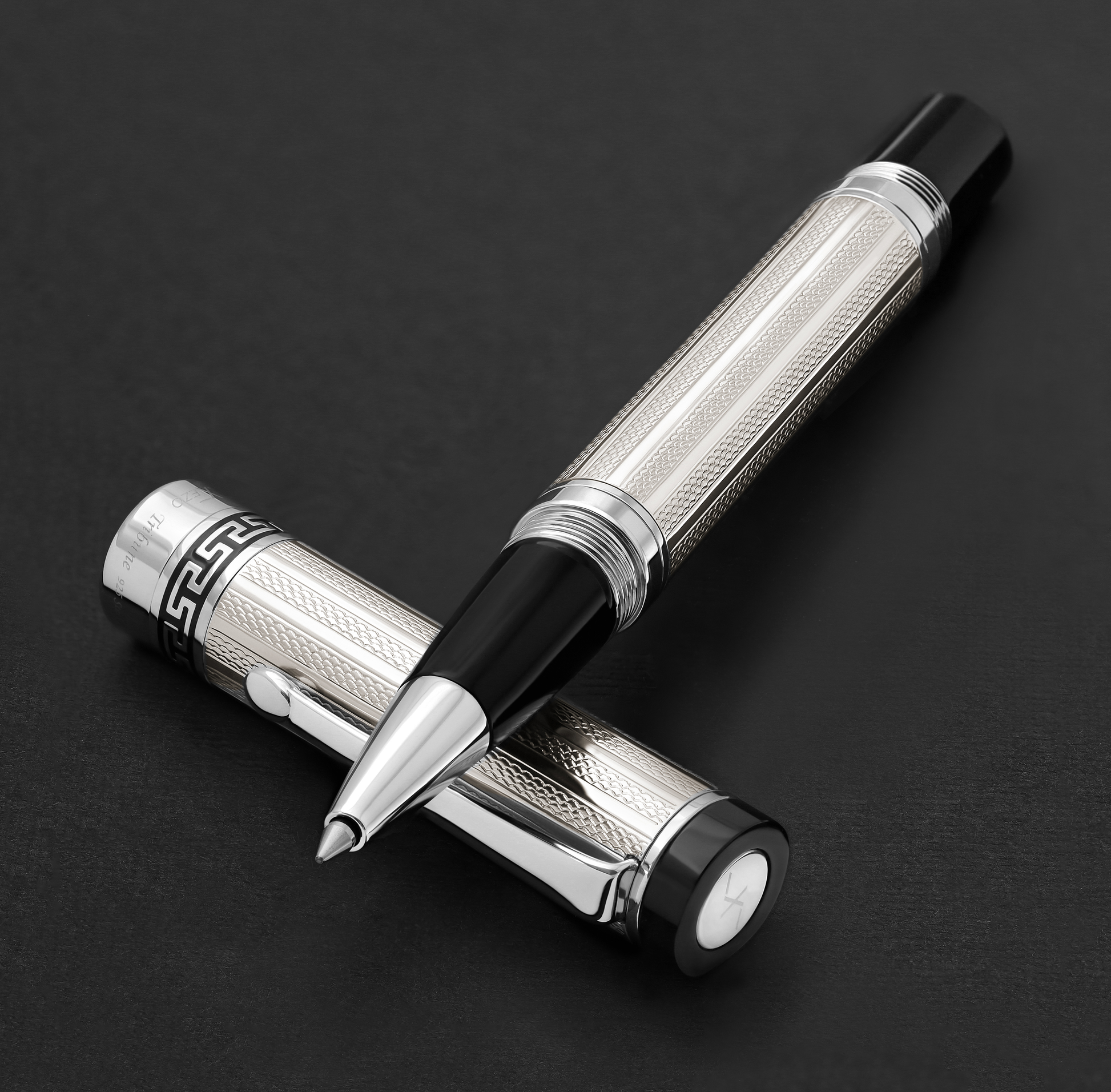 Xezo - Tribune 925 Sterling Silver R rollerball pen resting on its cap