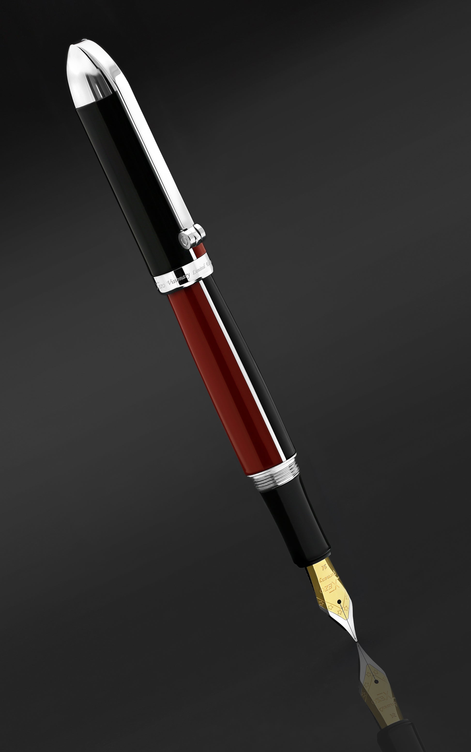 Xezo - Angled view of the side of the Visionary Red/Black FM fountain pen and the reflection of its tip on the surface