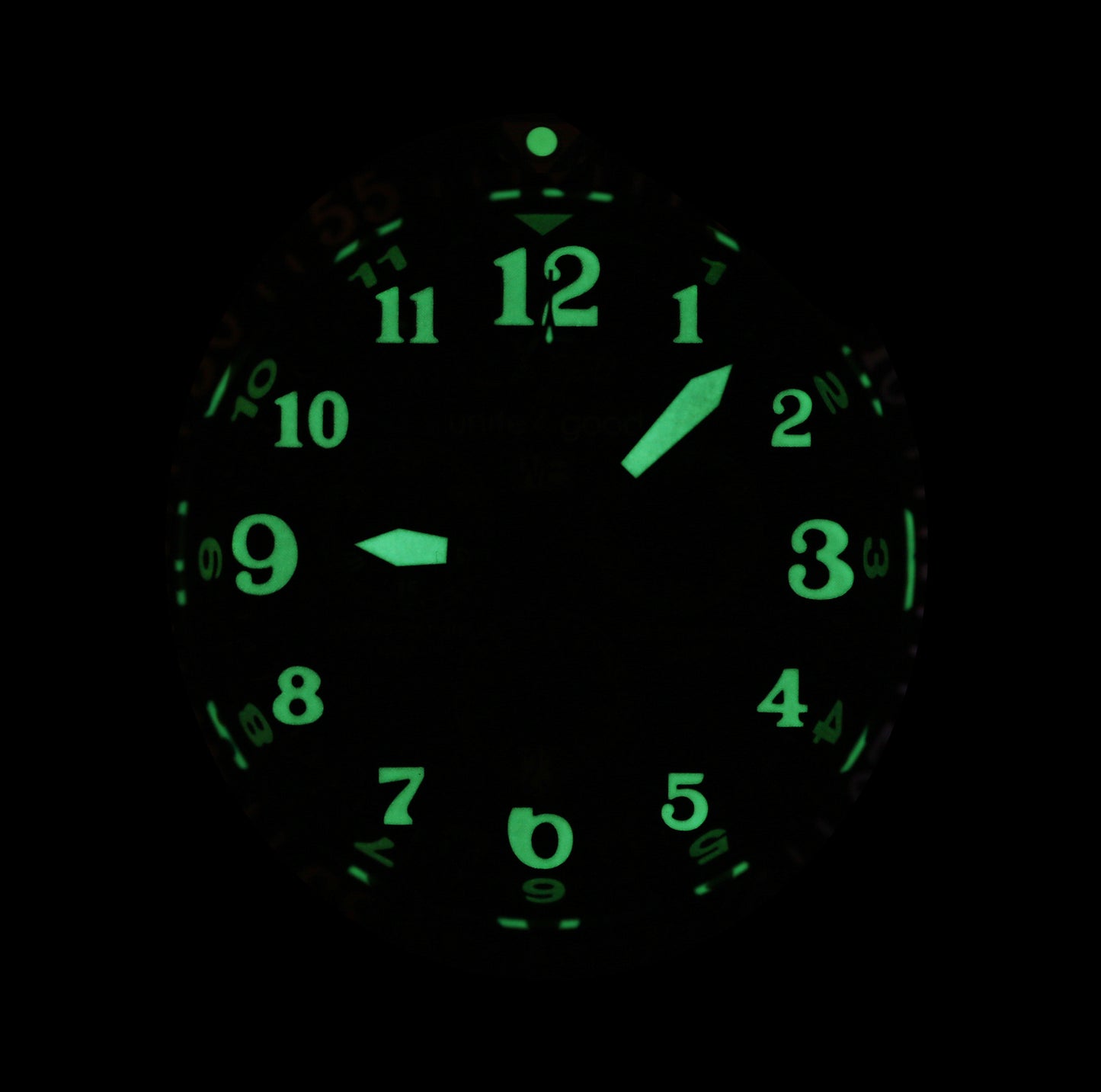 Xezo - Front view of the Air Commando D45-LB watch in dark displaying the luminescent numerals
