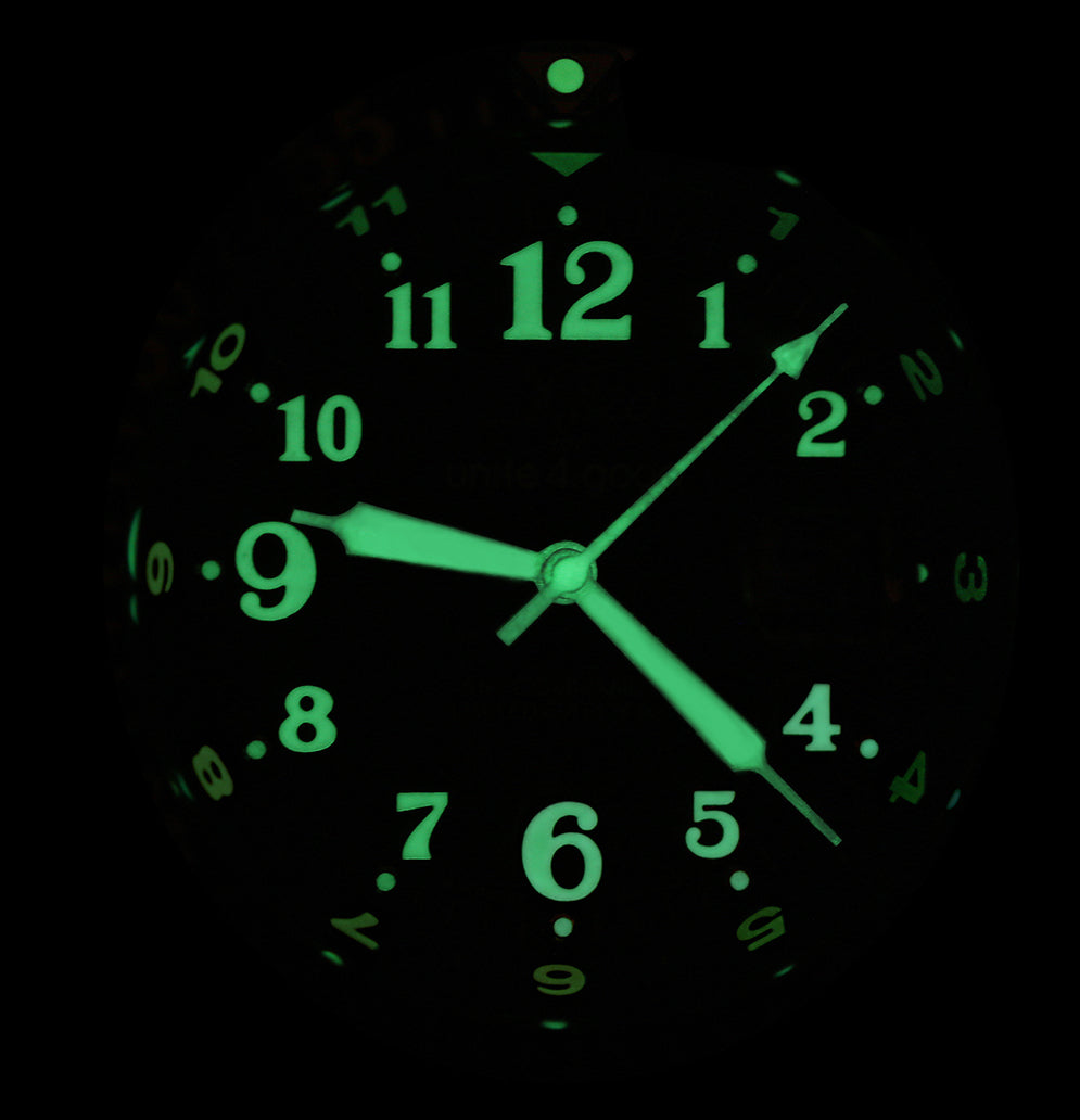 Xezo - Front view of the Air Commando D45-GL watch in dark displaying the luminescent numerals
