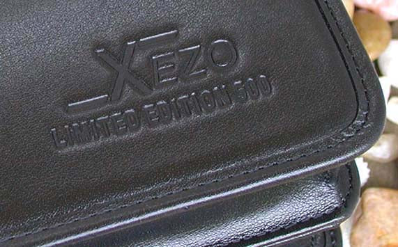Xezo - Branded front down-right corner of the Black Leather Briefcase. The brand reads "Xezo LIMITED EDITION 500".