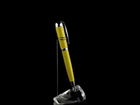 Xezo - A Visionary Speed Yellow/Black B Ballpoint pen standing on a turning pen stand