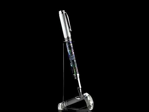 Xezo - A Maestro Paua Abalone Chrome R Rollerball pen standing on a turning pen stand