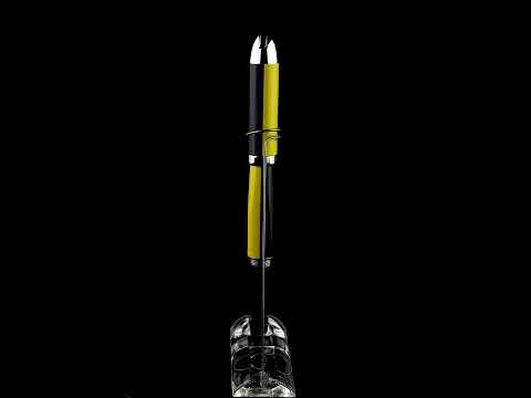 Xezo - A Visionary Speed Yellow/Black F Fountain pen standing on a turning pen stand