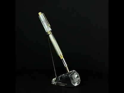 A video of a Maestro 925 White MOP R rollerball pen standing on a turning pen holder