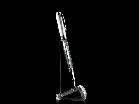 Xezo - A Maestro Black MOP Chrome F Fountain pen standing on a turning pen stand