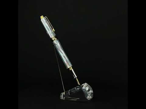 Xezo - A Maestro White MOP fountain pen standing on a turning pen stand