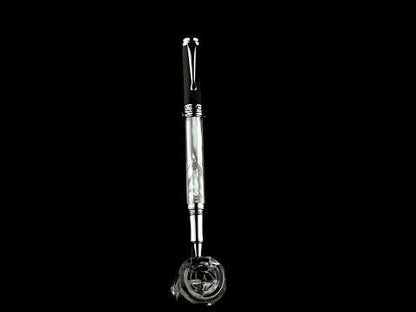 Maestro White MOP PVD R rollerball pen standing on a rotating stand