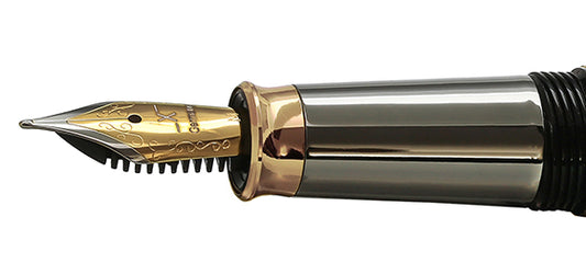 Xezo - Angled view of the side of the Medium Fountain Nib with gold-plated body, stainless steel tines, and tungsten-gold-plated grip section. Compatible with Maestro Black Mother of Pearl Tungsten fountain pen series. The body of the nib has motif patterns.