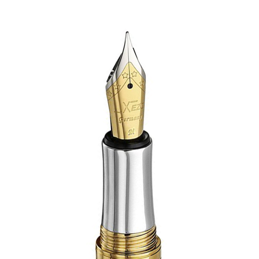 Xezo - Angled view of the front of the Medium Fountain Nib - with gold-plated body, stainless steel tines, and platinum-plated grip section.  Compatible with Maestro Pens. The body of the nib has star patterns.