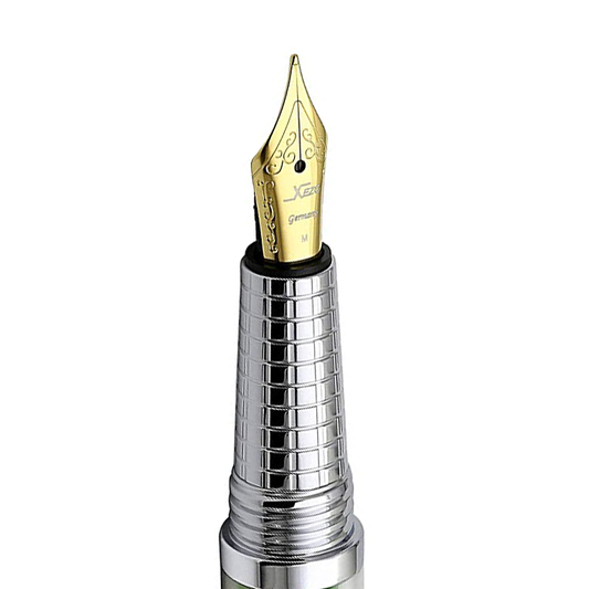 Xezo - Angled view of the front of the Medium Fountain Nib with gold-plated body - Compatible with Urbanite II series fountain pens. The body of the nib has motif patterns.