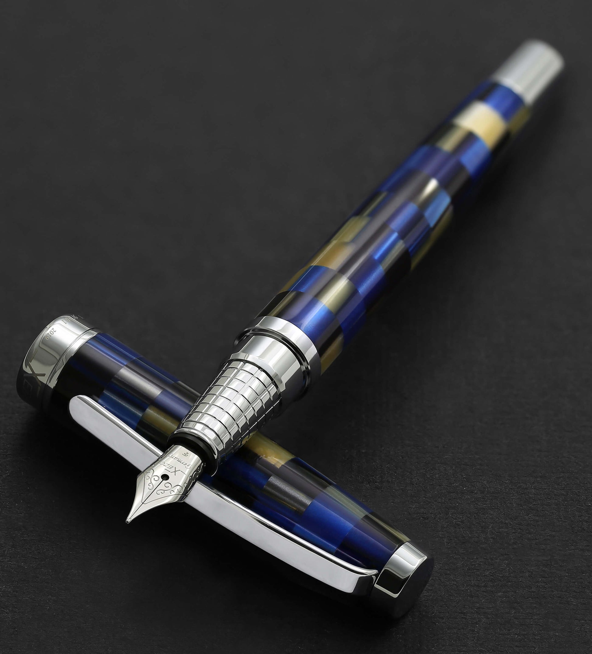Xezo - Urbanite Blue F fountain pen resting on its cap